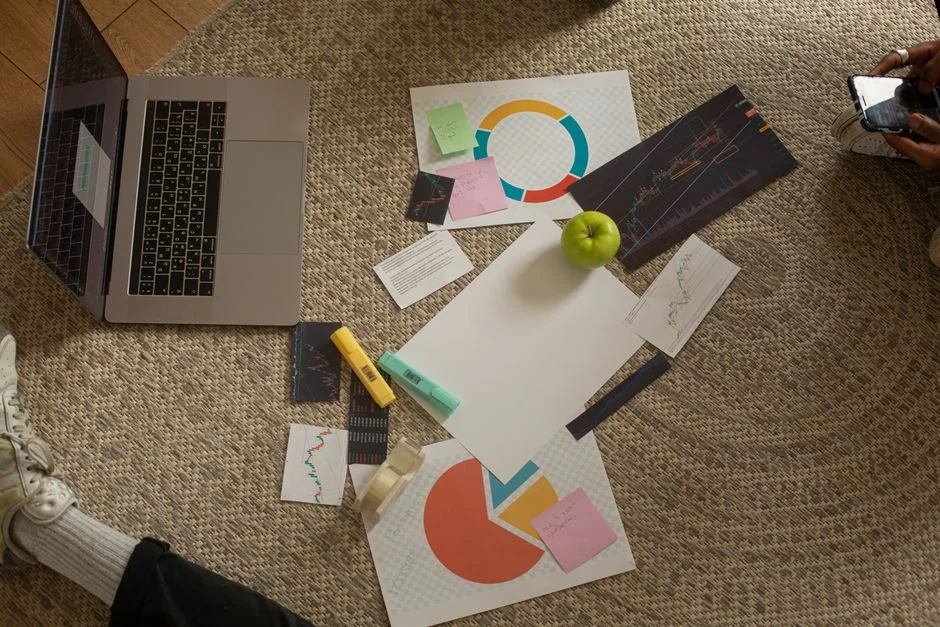 Close-up view of a social media marketing document lying on a desk beside a pen and notebook.